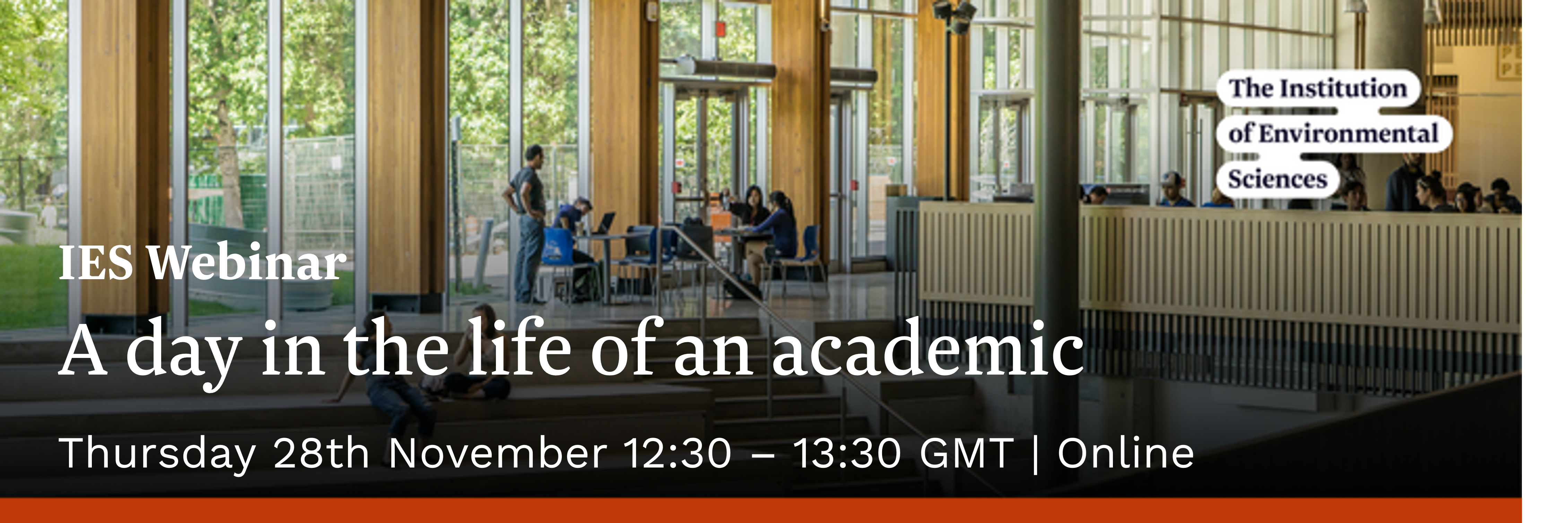 Photograph of student chatting in university atrium with text "A day in the life of an academic"